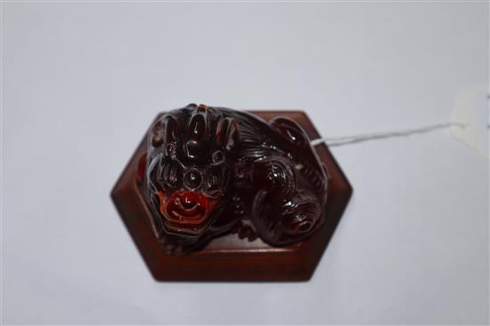 A Japanese ivory cane handle, a faux amber lion-dog and an enamel and ivory pill box